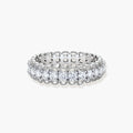Sterling silver eternity ring with continuous row of brilliant moissanite stones in scalloped crown setting with milgrain detail