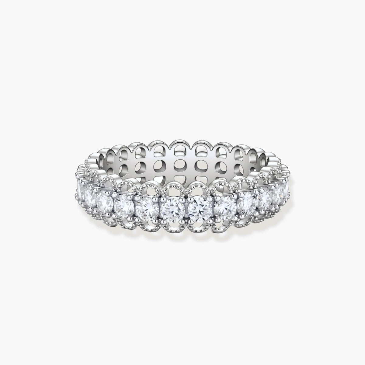 Sterling silver eternity ring with continuous row of brilliant moissanite stones in scalloped crown setting with milgrain detail